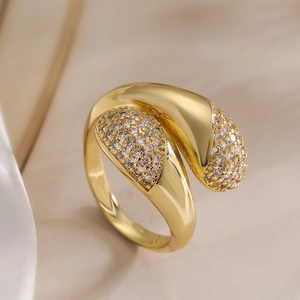 Irregular geometric crossover ring with gold plating and paved sparkling zircon stones