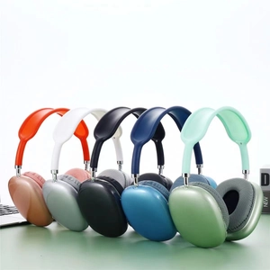 Overhead shot of P9 wireless headphones in multiple vibrant colors on a green surface