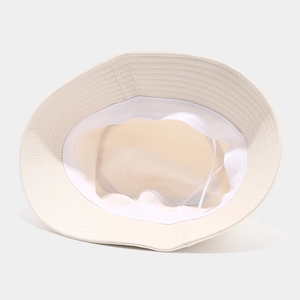 Detail view of cotton bucket hat interior with sweatband and adjustable wind rope