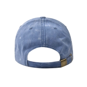 Detail of blue washed denim baseball cap with adjustable metal buckle back strap