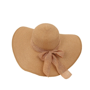 Women's foldable wide brim straw sun hat with mesh bow detail for beach and outdoor protection