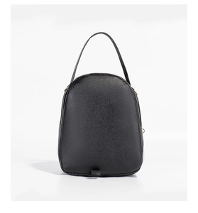 Rear view of minimalist black backpack featuring pebble leather texture and sturdy handle