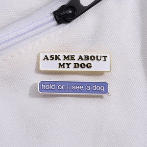 Enamel lapel pins with funny dog lover quotes on white canvas bag accessory