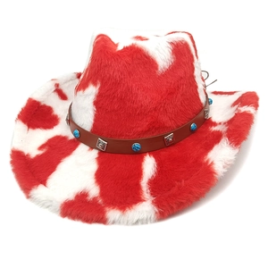 Detail of red and white cow print cowboy hat with turquoise and leather band