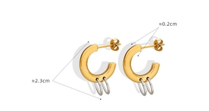 Detail shot of two-tone C-shape hoop earrings with 2.3cm diameter and gold-silver finish