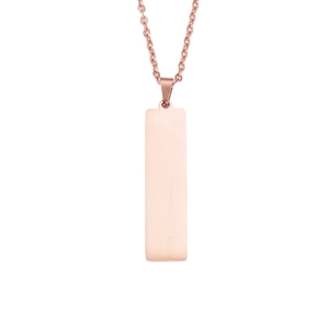 Close-up of a polished rose gold rectangular pendant on a delicate chain necklace