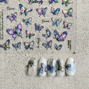 Detail of laser butterfly nail stickers with 3D embossed texture and colorful effect