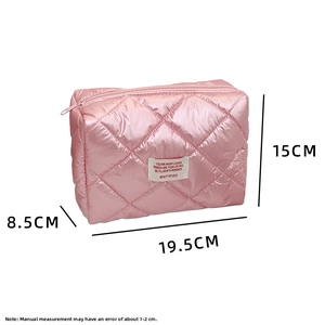 Pink quilted cosmetic bag dimensions 19.5x15x8.5cm with top zipper and soft fabric texture