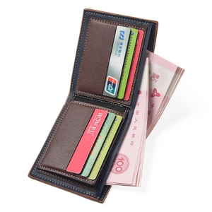Detail of bifold wallet with lychee grain leather, contrast stitching and card slots