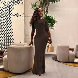 Detail of a dark brown long-sleeve bodycon fishtail dress with high waist and slim fit