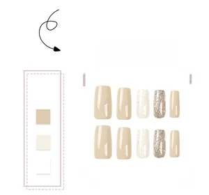Detailed view of French square press-on nails with nude, gold glitter, and gold foil motifs