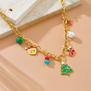 Golden Christmas theme necklace with enamel Santa, tree, and bell charms on stone plate