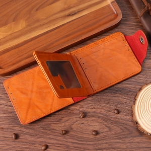 Retro brown leather wallet with multi-card slots and ID window on dark wood background