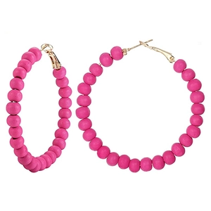 Detailed view of hot pink beaded hoop earrings with gold hooks for summer vacation style