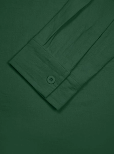 Detailed macro view of deep green linen shirt cuff featuring fabric texture and buttons