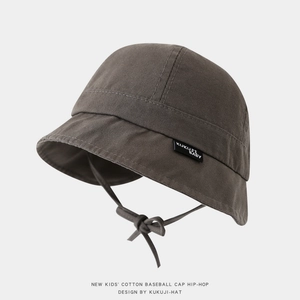 Detail view of cotton sun hat for toddlers with chin strap and brand woven label