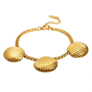 18K gold plated stainless steel bracelet featuring three scallop shell charms on a white background