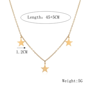 Detailed view of gold star necklace with 45+5cm length and 1.2cm star pendants