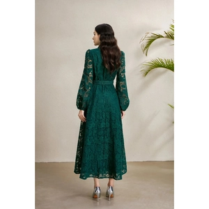 Deep green lace maxi dress with lantern sleeves and A-line silhouette, back view of the model