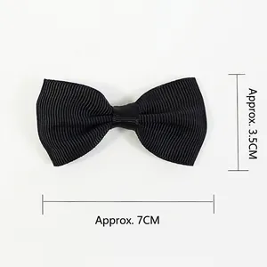 Black ribbed fabric bow hair clip 7cm width for girls and babies shown on white background