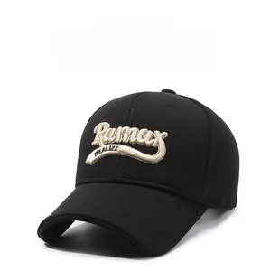 Macro view of detailed gold 3D embroidery on a black cotton baseball cap