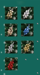 Detailed view of artificial Christmas berries in gold silver and red with faux snow coating