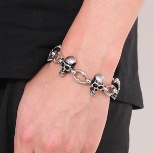 Vintage punk silver skull bracelet for men in distressed stainless steel on wrist