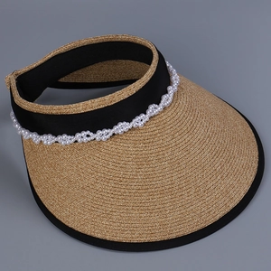 Detailed view of elegant straw sun visor with pearl decoration and black trim