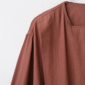 Women's brick red crew neck jacket with zipper detail and soft suede texture