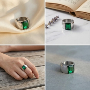 Detailed views of a wide silver band ring featuring a rectangular emerald green gemstone