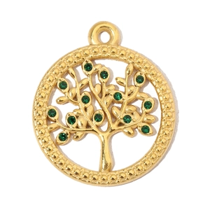 Macro detail of golden Tree of Life pendant with green crystals and stainless steel finish