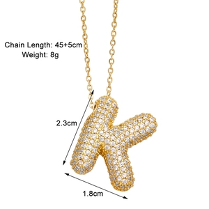 Detail view of gold letter K necklace with zircon inlay and product size specifications