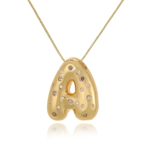 Macro detail of 18k gold plated puffy letter A pendant with sparkling cubic zirconia inlay