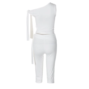 Detail of white one-shoulder top with long ribbon and matching slim cropped pants