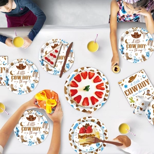 Detail of Western cowboy theme party tableware set with plates, cups and napkins