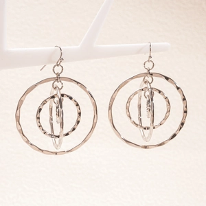 Detailed view of silver multi-layered hoop earrings with unique hammered metal texture