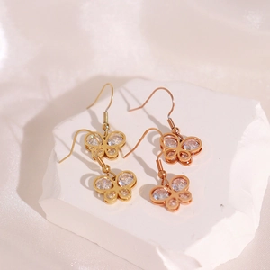 Elegant butterfly drop earrings with zircon crystals in gold and rose gold finishes