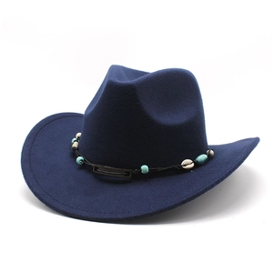 Detail of dark blue wool fedora featuring an ethnic beaded band with shells and lapis beads