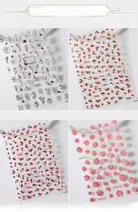 Detail of 3D embossed nail stickers featuring silver angels, cherries, and peaches