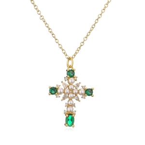 18K gold plated cross necklace with white pearls and green zircons on white background