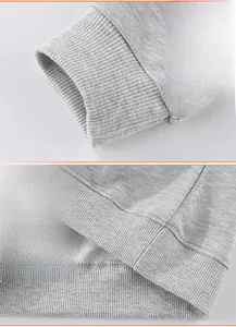 Detail of ribbed cuffs and hem on a gray mottled boys' sweatshirt with fine knit texture