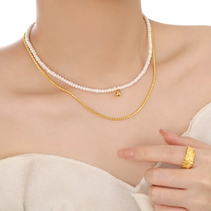 Natural freshwater pearl necklace with gold sphere pendant and layered gold chains