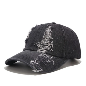 Vintage black distressed denim baseball cap with distressed hole details and street style