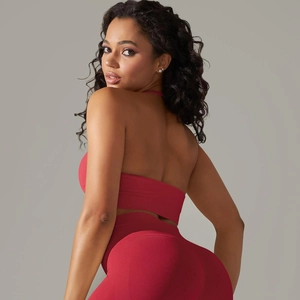 Detail showing high-elastic seamless ribbed fabric of the red yoga vest and leggings set