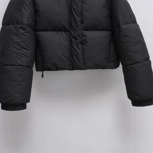 Women's slim fit hooded puffer jacket in matte black featuring horizontal quilting