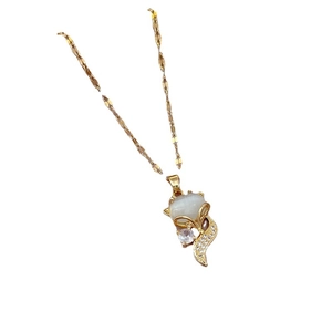 Elegant gold fox pendant necklace featuring opal cat eye stone and sparkling crystals