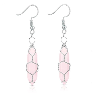 Detail of pink crystal hexagonal pillar earrings with silver wire wrapping craft