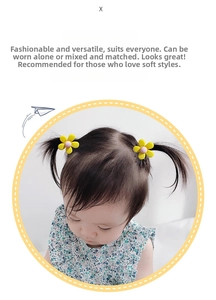Close-up of yellow daisy hair accessory worn on a young girl's braided pigtail