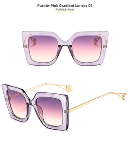 Detail of oversized square sunglasses with gradient purple lenses and pearl gold temples