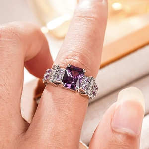 Macro detail of a square purple gemstone ring with micro-pave diamonds in silver finish